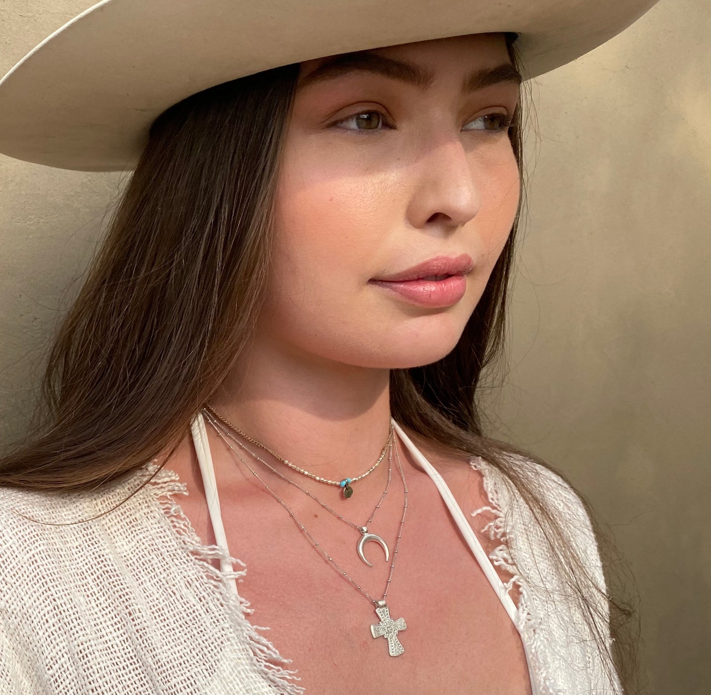 Silver moon necklace styled on model