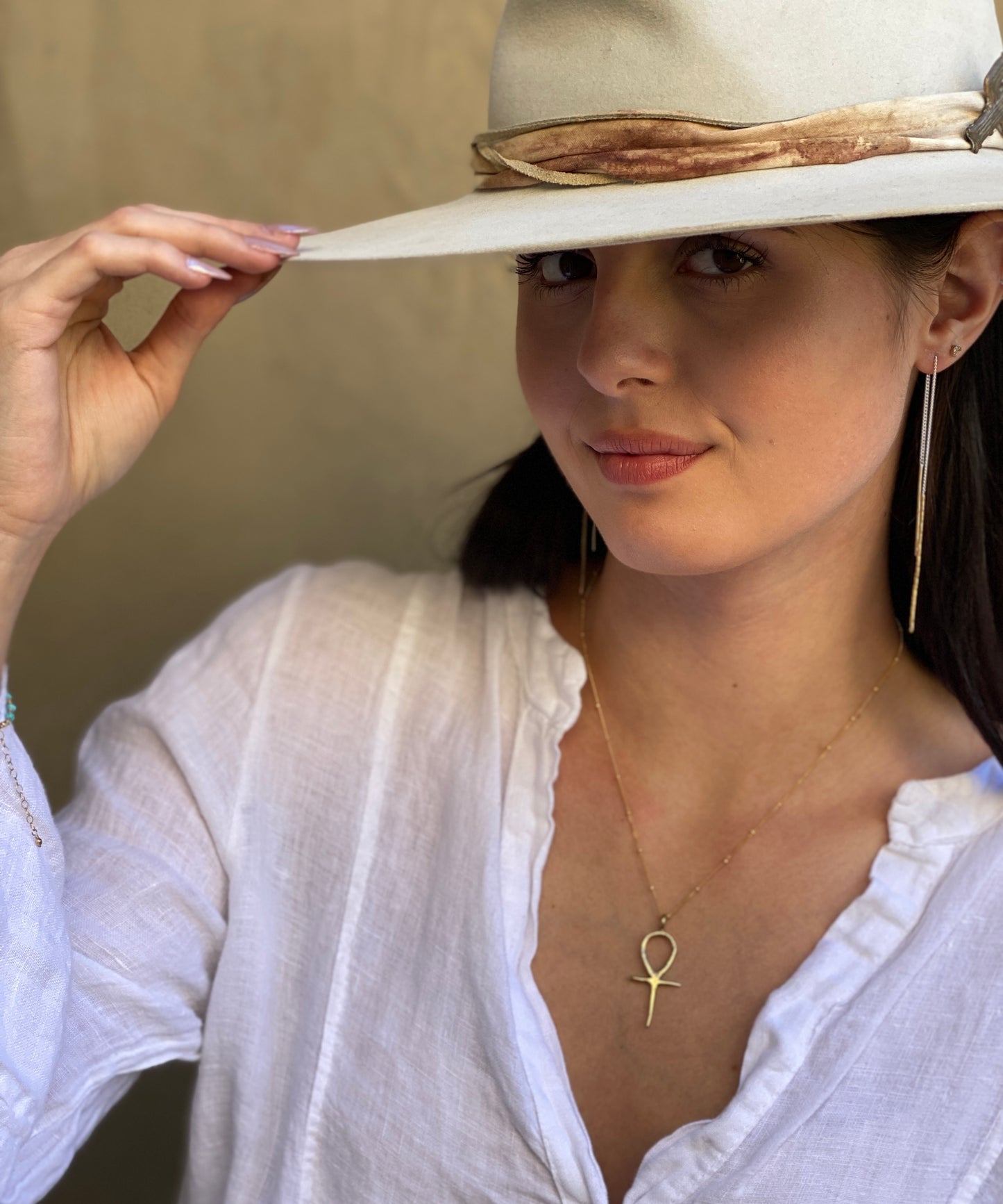 Gold Ankh pendant on satellite chain on model