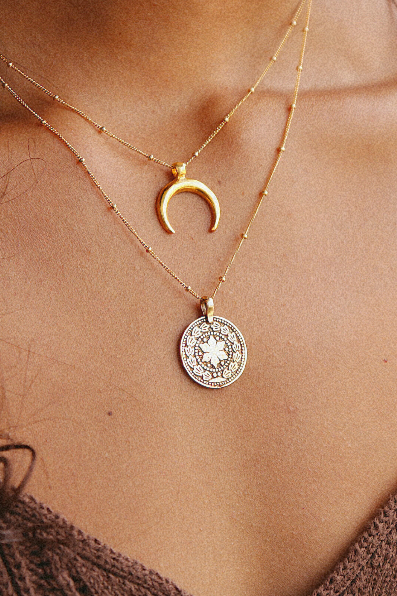 Crescent Moon Necklace in gold on model