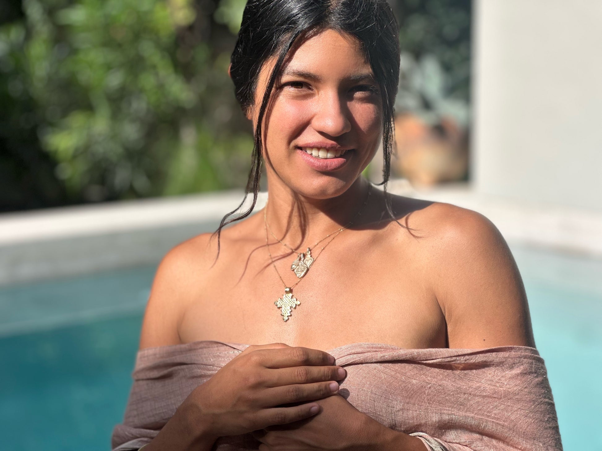 Gold Ethiopian Cross Necklace styled on model