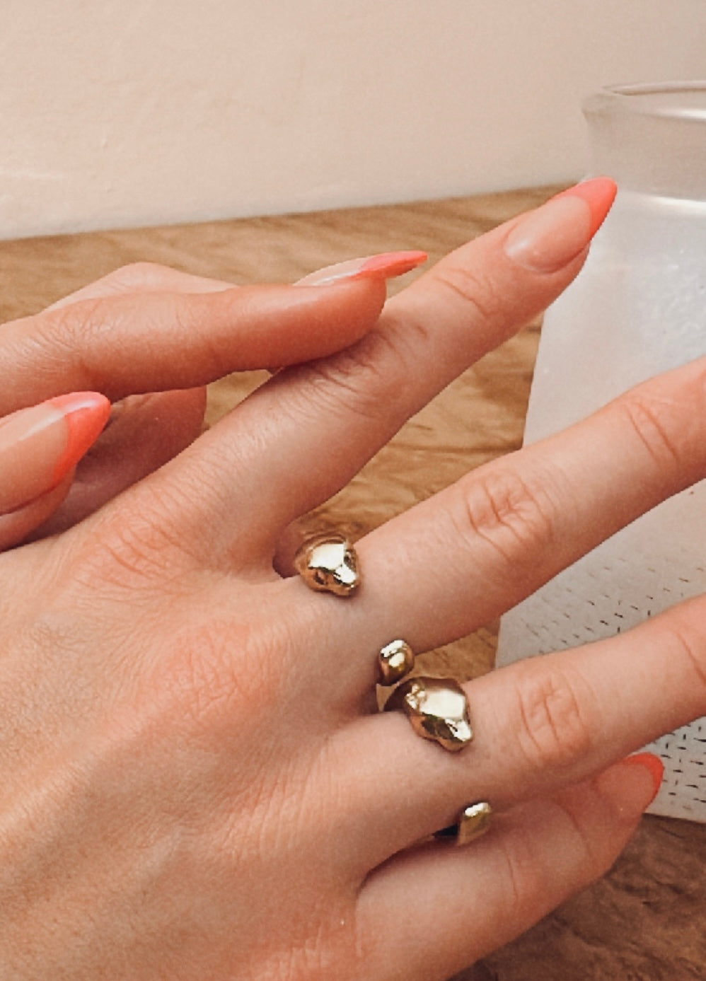 Two gold Fierce Panther Rings with bronze panther wrap design on model