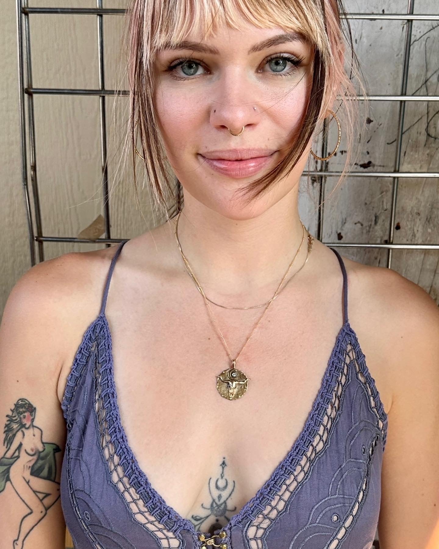 Bronze pendant engraved with longhorn bullhead and crystal sun on model