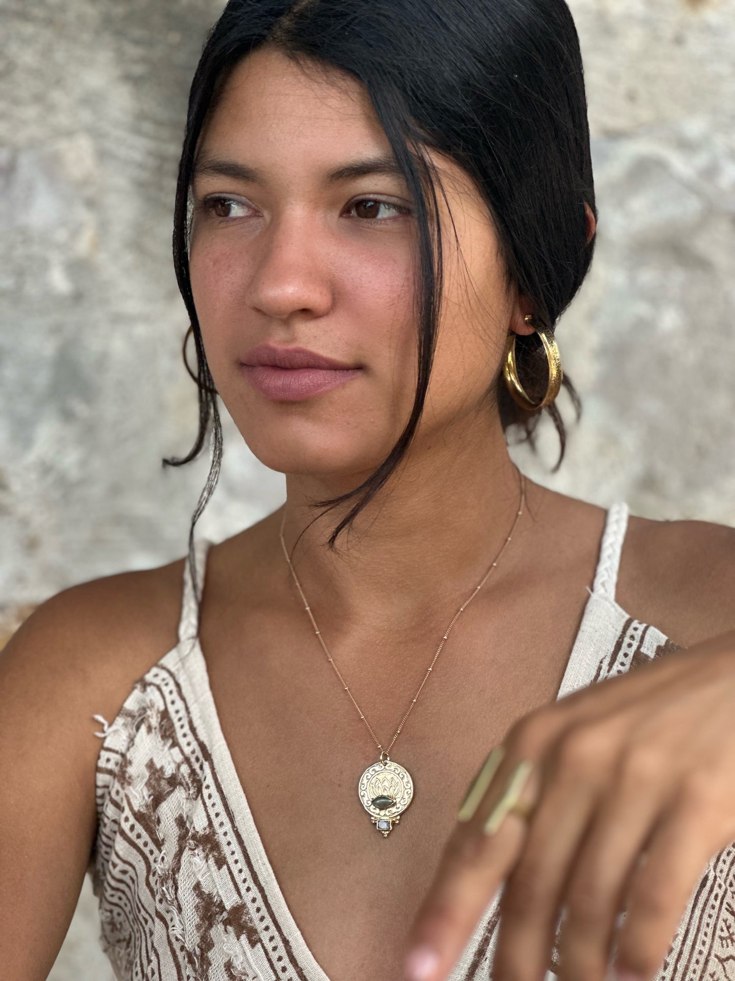 Bronze lotus and Ohm pendant on gold chain