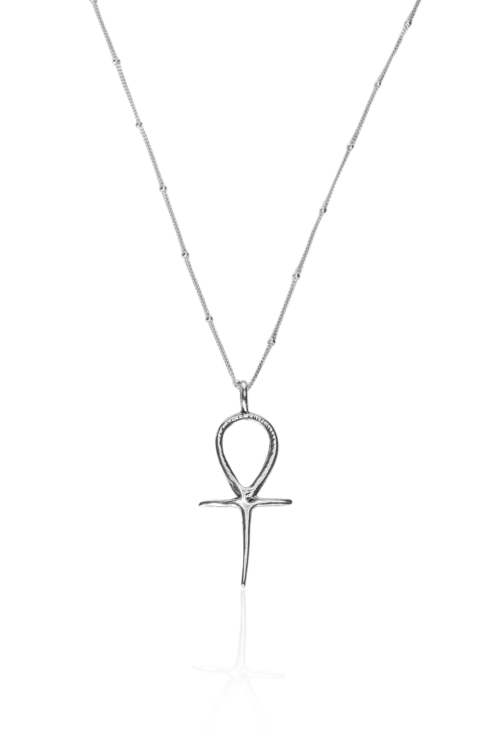 Close-up of silver Ankh pendant on silver chain