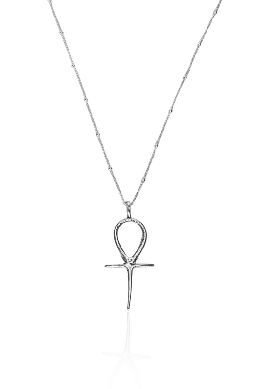 Close-up of silver Ankh pendant on silver chain