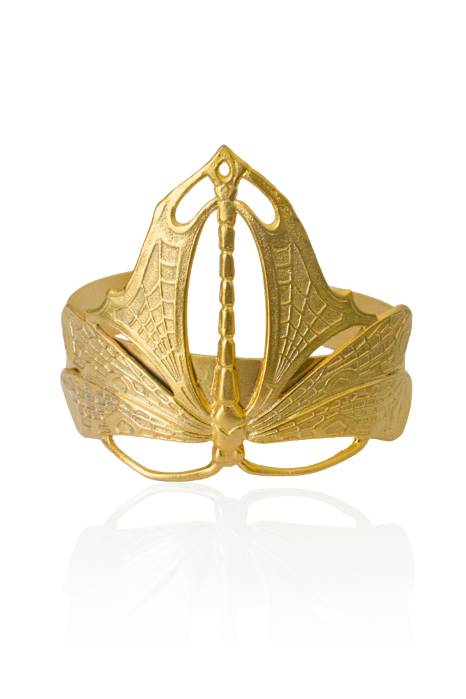 Gold dragonfly cuff bracelet with detailed engraved wings on an adjustable open band.