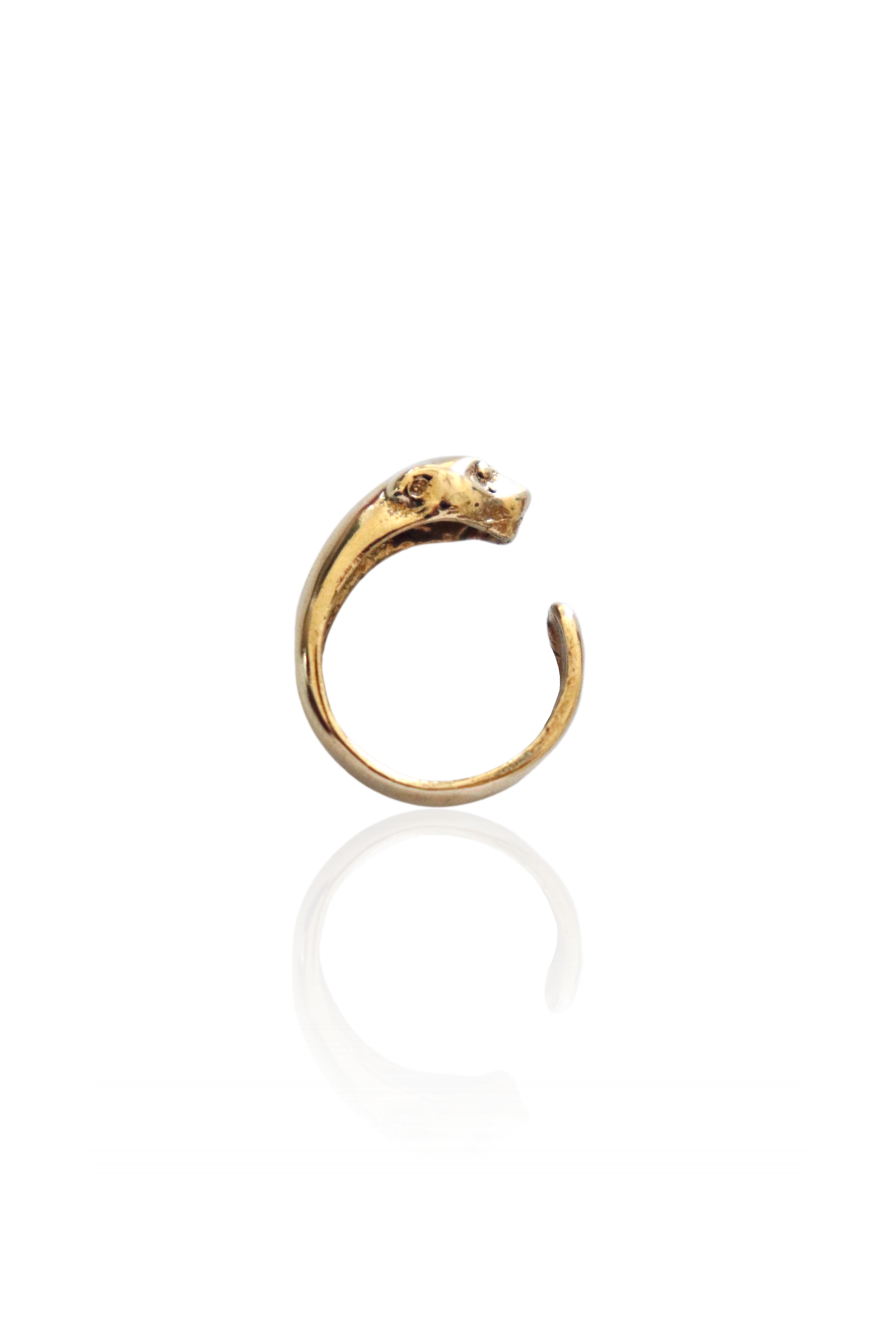 Close-up of bronze panther head and tail on gold ring