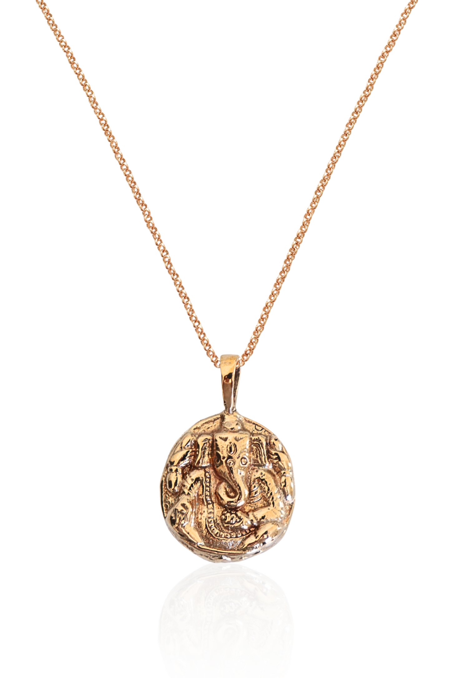 Close-up of bronze Ganesha pendant engraved detail on gold chain