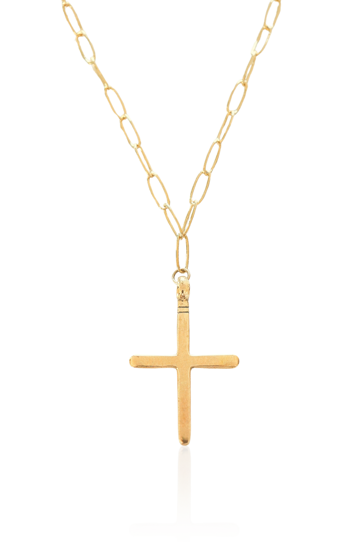 Close-up of gold cross pendant on 14K gold-plated chain