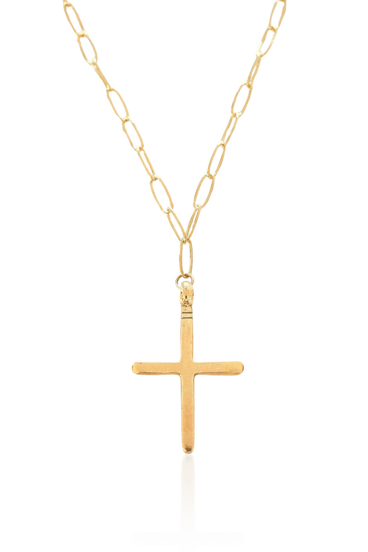 Close-up of gold cross pendant on 14K gold-plated chain