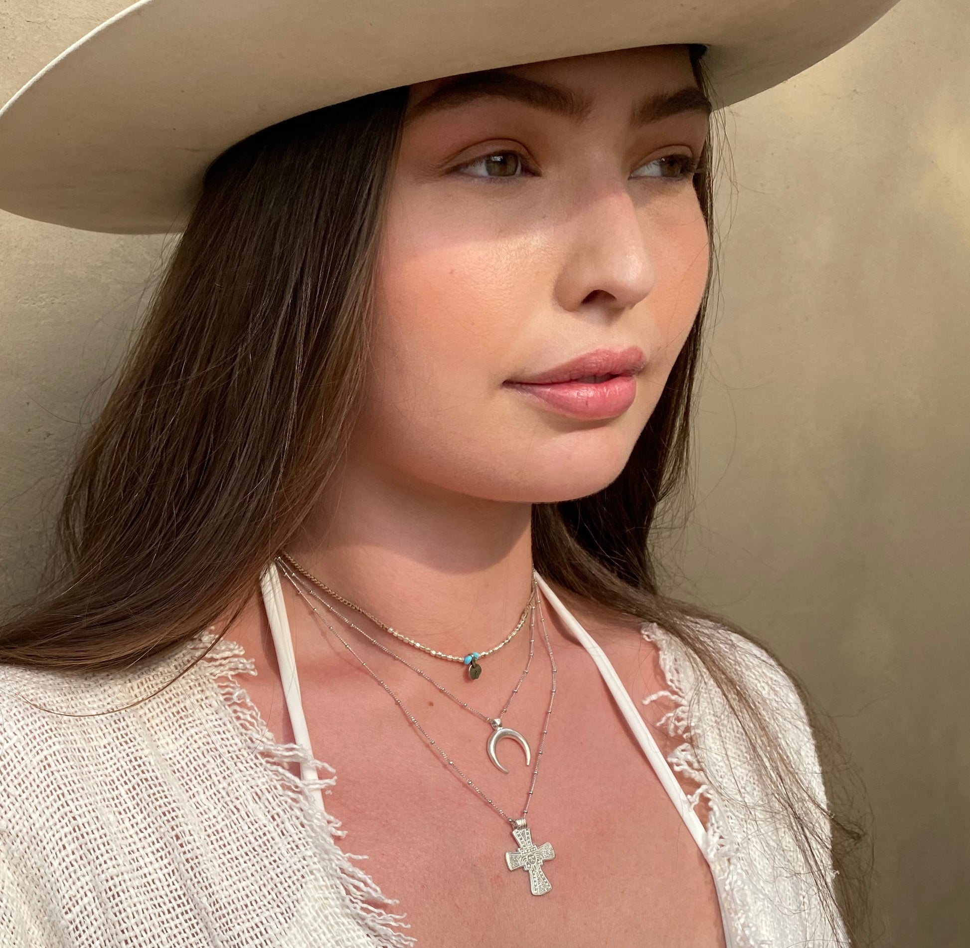 Silver moon necklace styled on model
