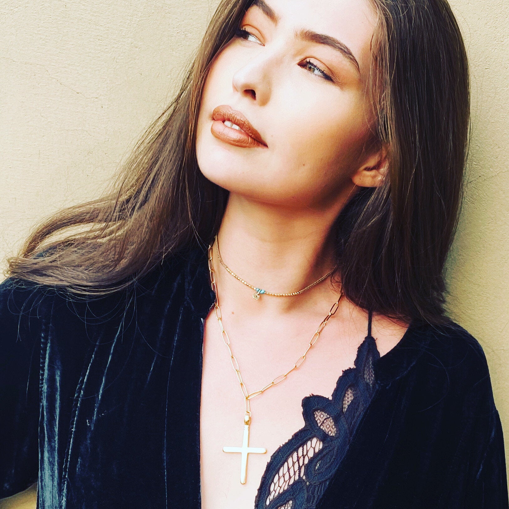 Gold faith necklace styled on model